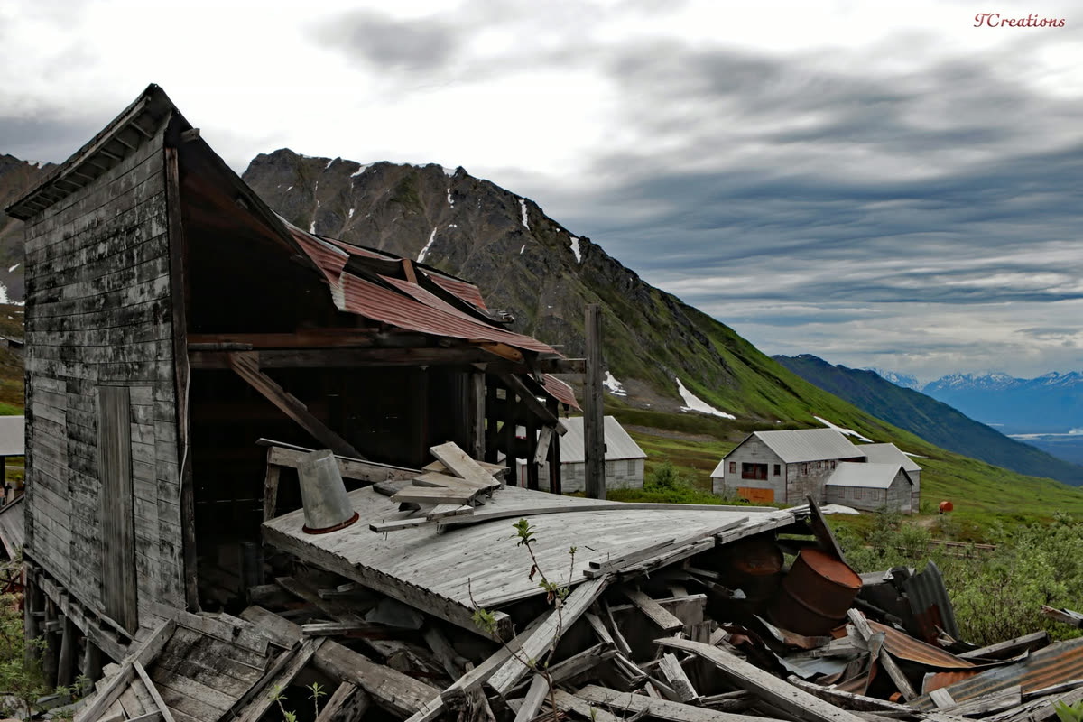 An abandoned mining cabin below Alaskan peaks